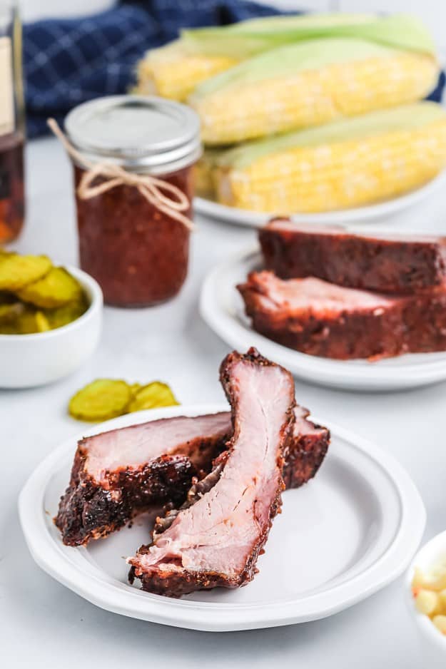 smoked ribs on white plates.