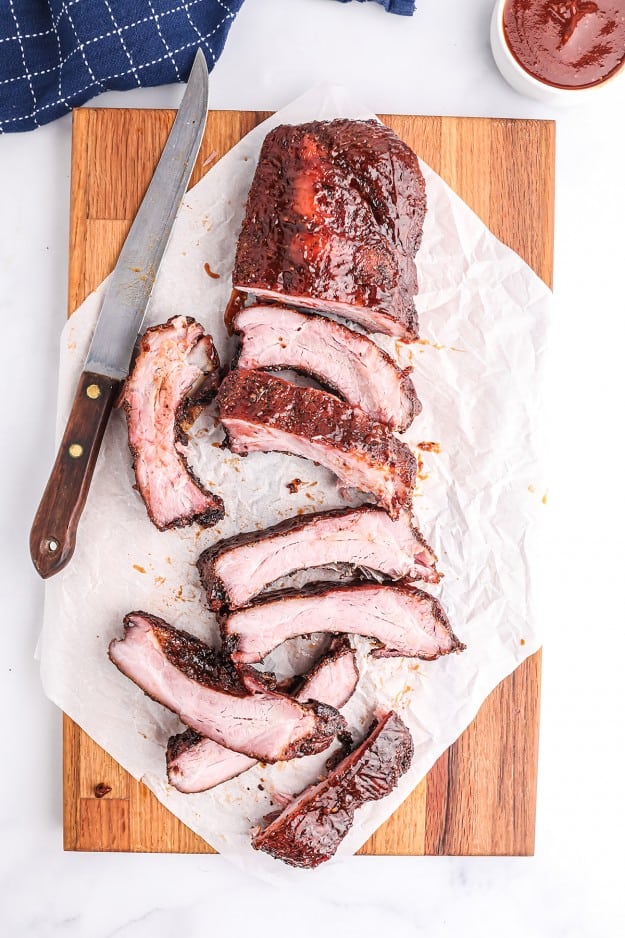 sliced ribs on cutting board.