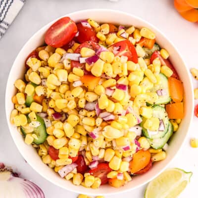 Corn tomato salad in white bowl.