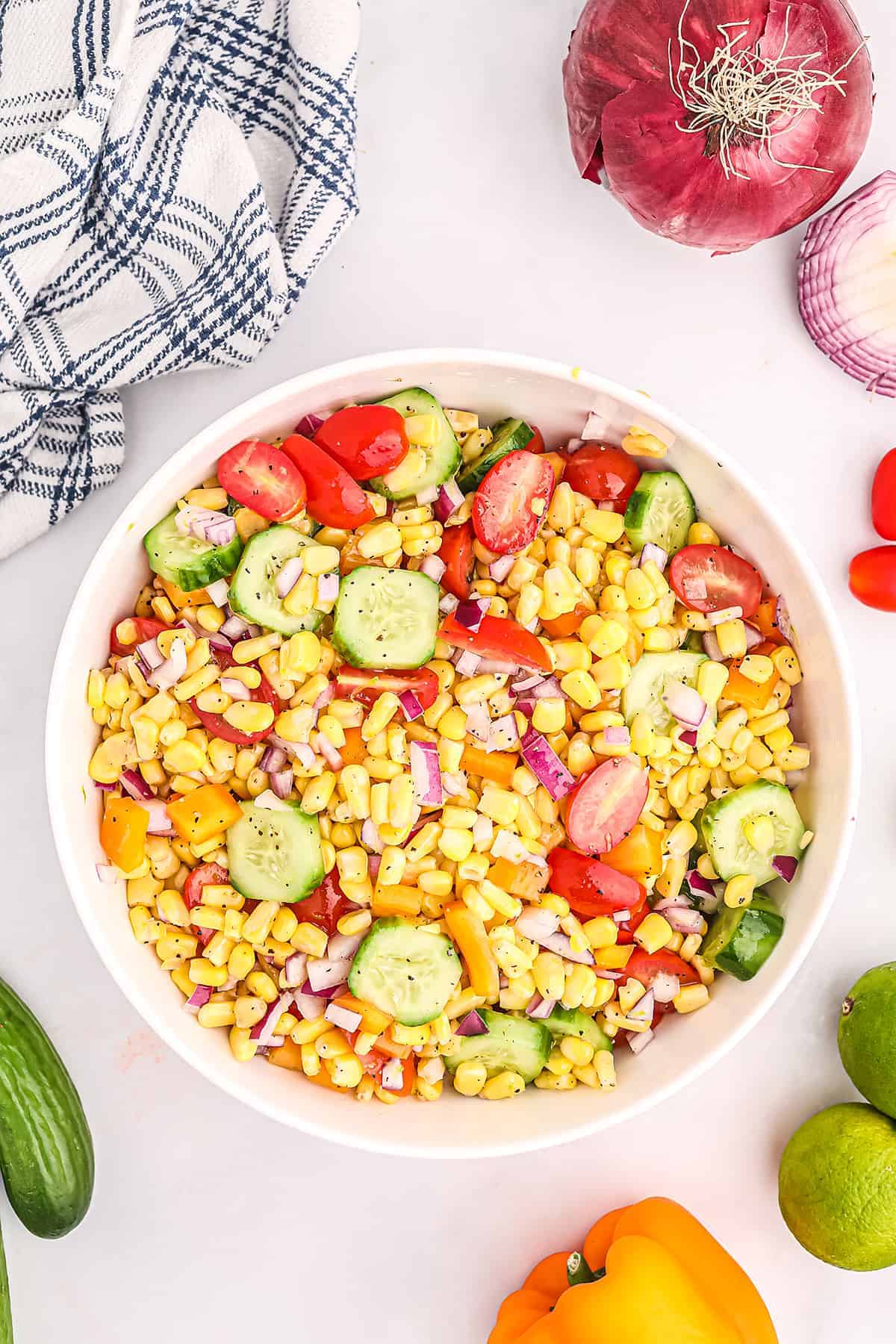 summer corn salad ingredients in white mixing  bowl.