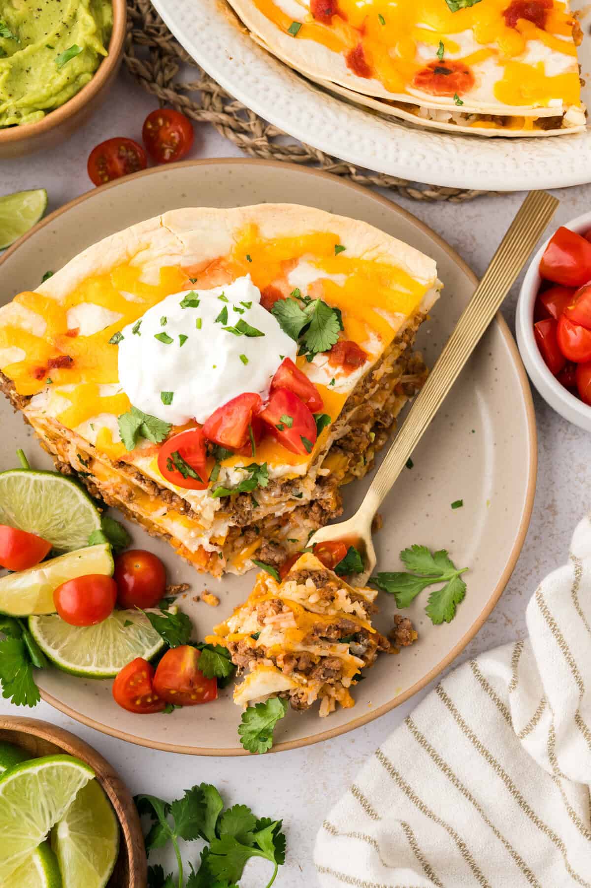 Plate with burrito casserole and a fork.