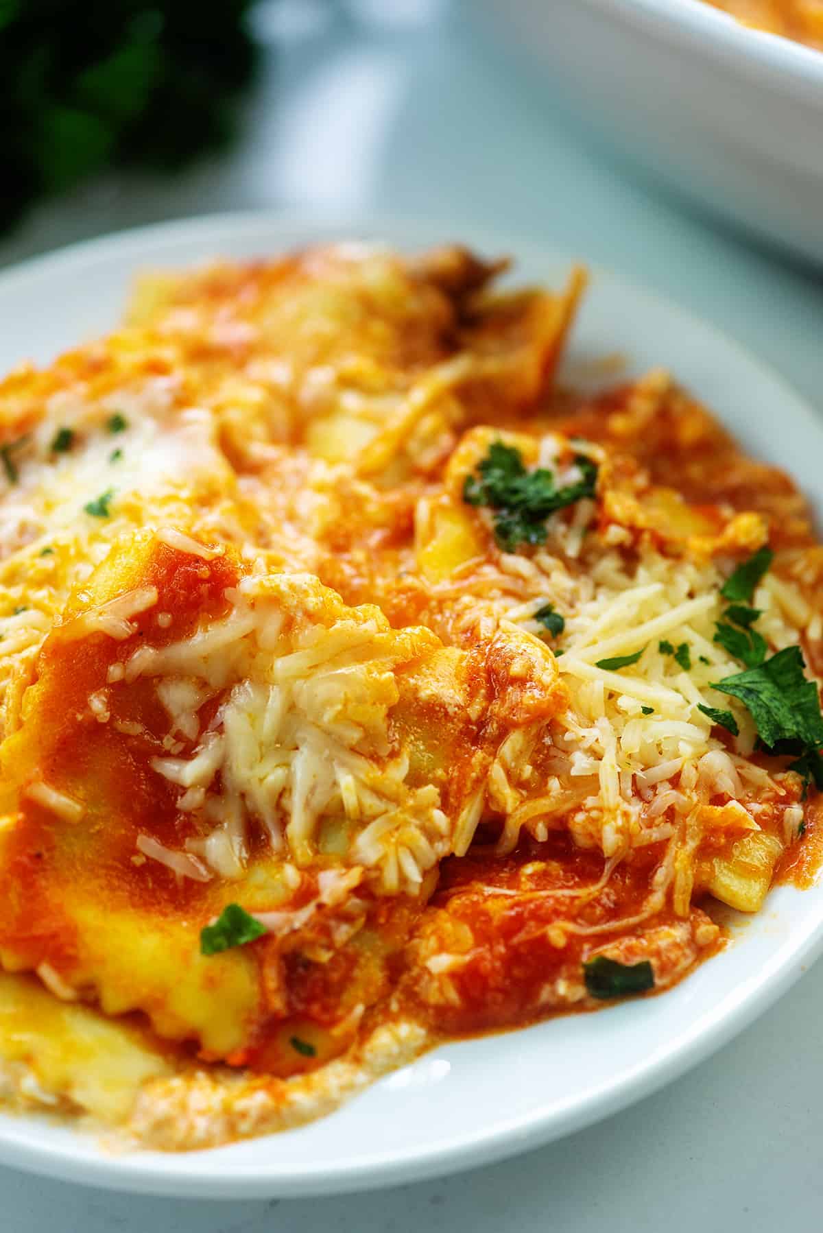 baked ravioli on white plate.