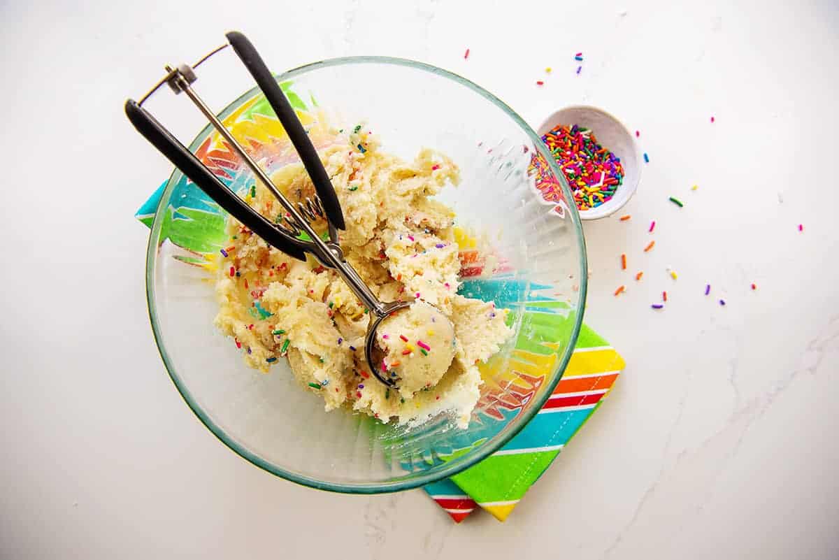 sugar cookie dough in glass mixing bowl.