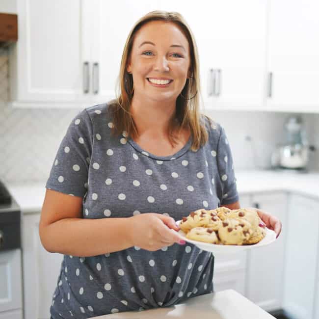 karly campbell holding a plate of cookies.