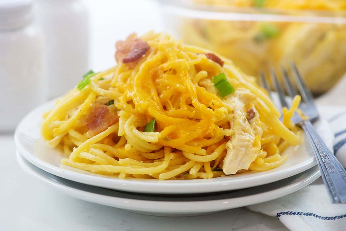 crack chicken spaghetti on white plate.