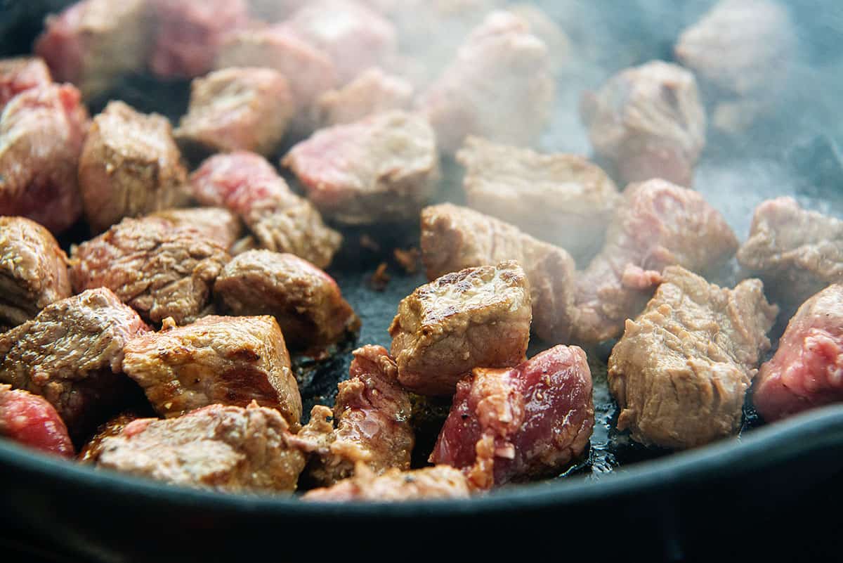 seared beef in skillet.