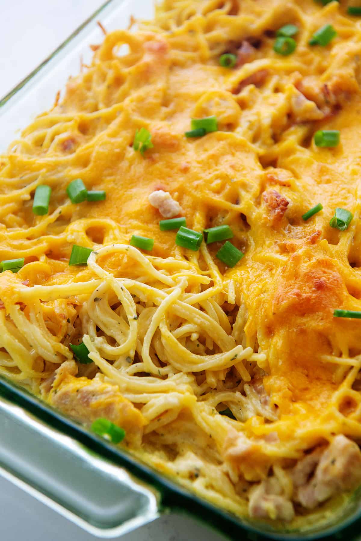 crack chicken spaghetti in glass baking dish.