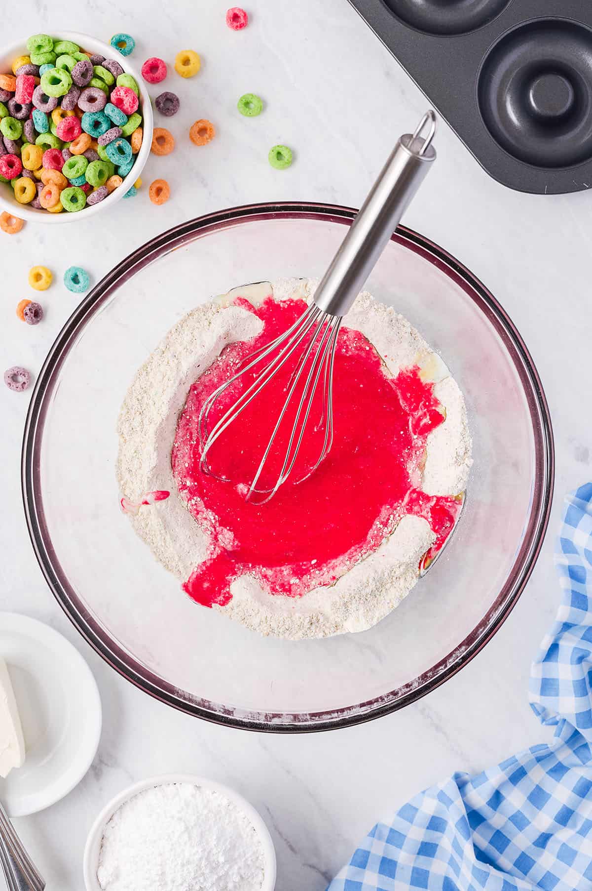 batter for fruit loop donuts in glass bowl.