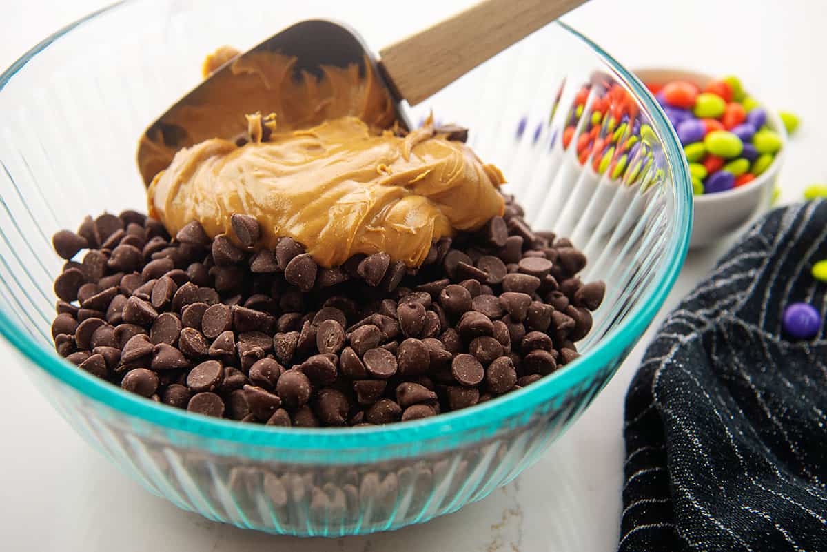 peanut butter and chocolate chips in glass bowl.
