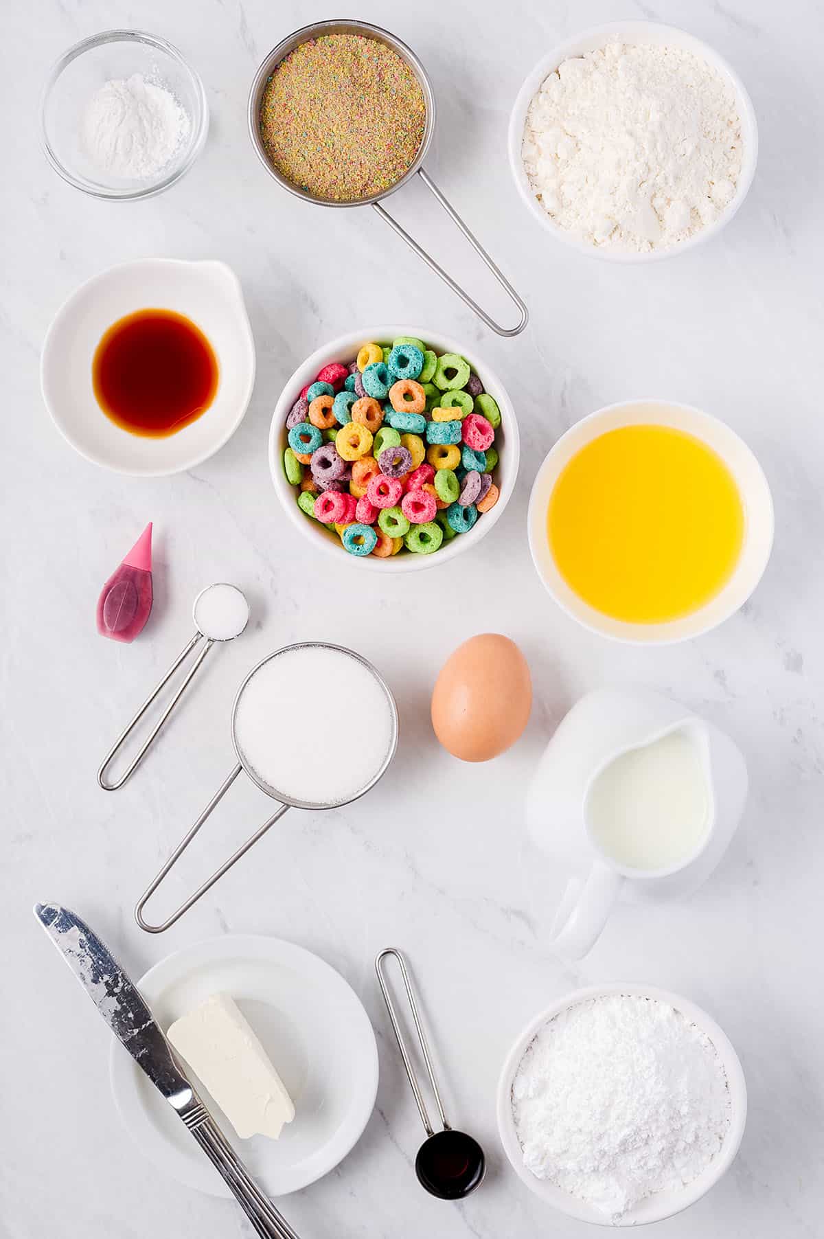 ingredients for Fruit Loop donuts on white counter.