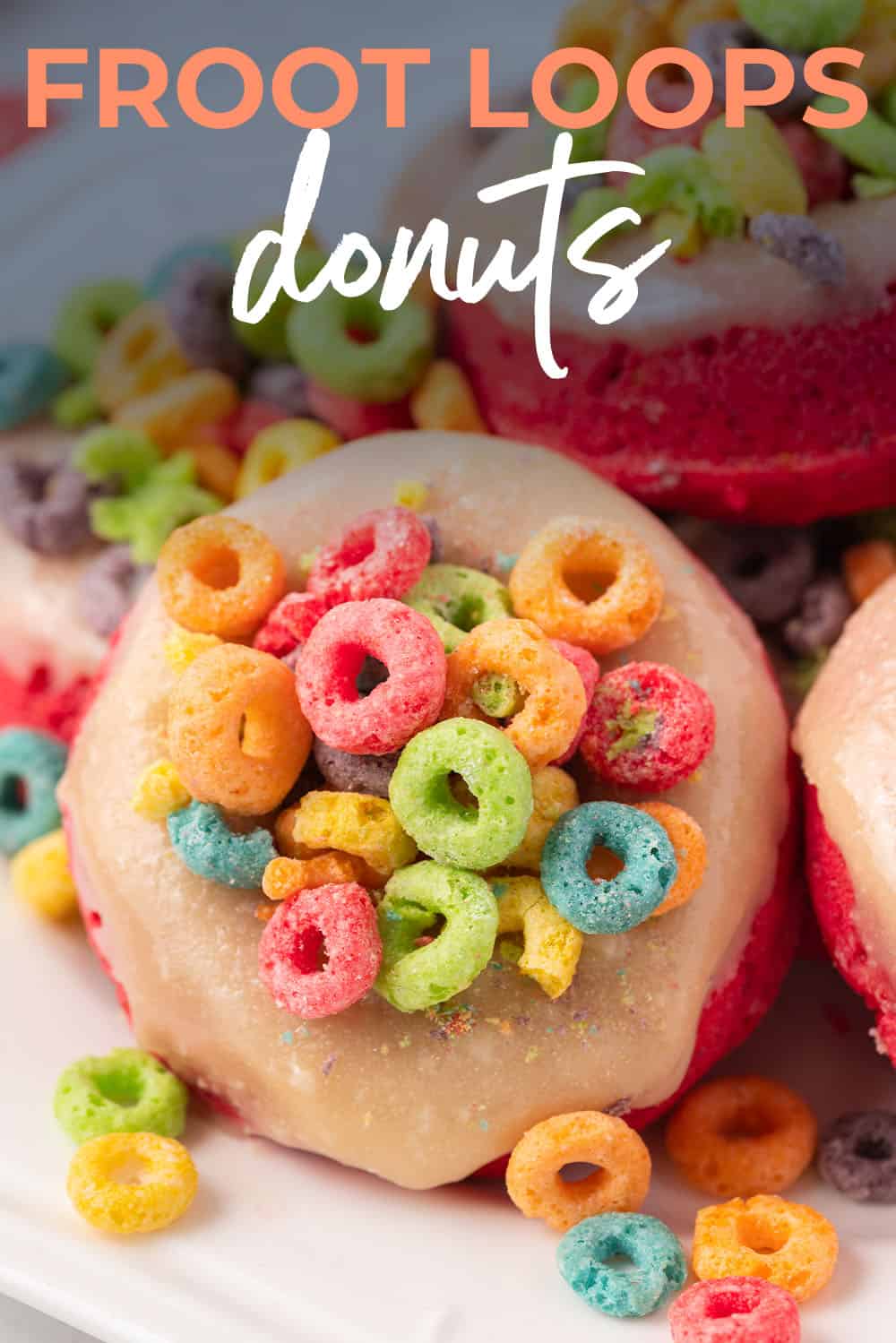 froot loops baked donuts piled on plate.