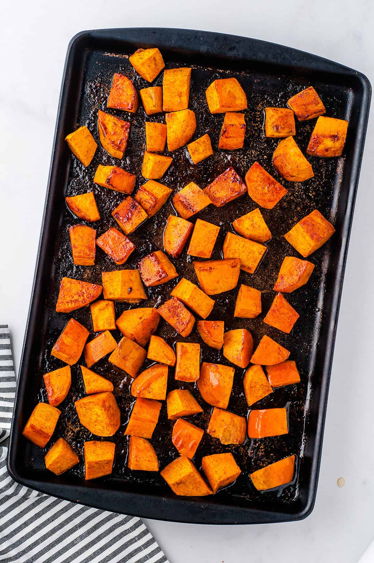 roasted sweet potatoes on sheet pan.