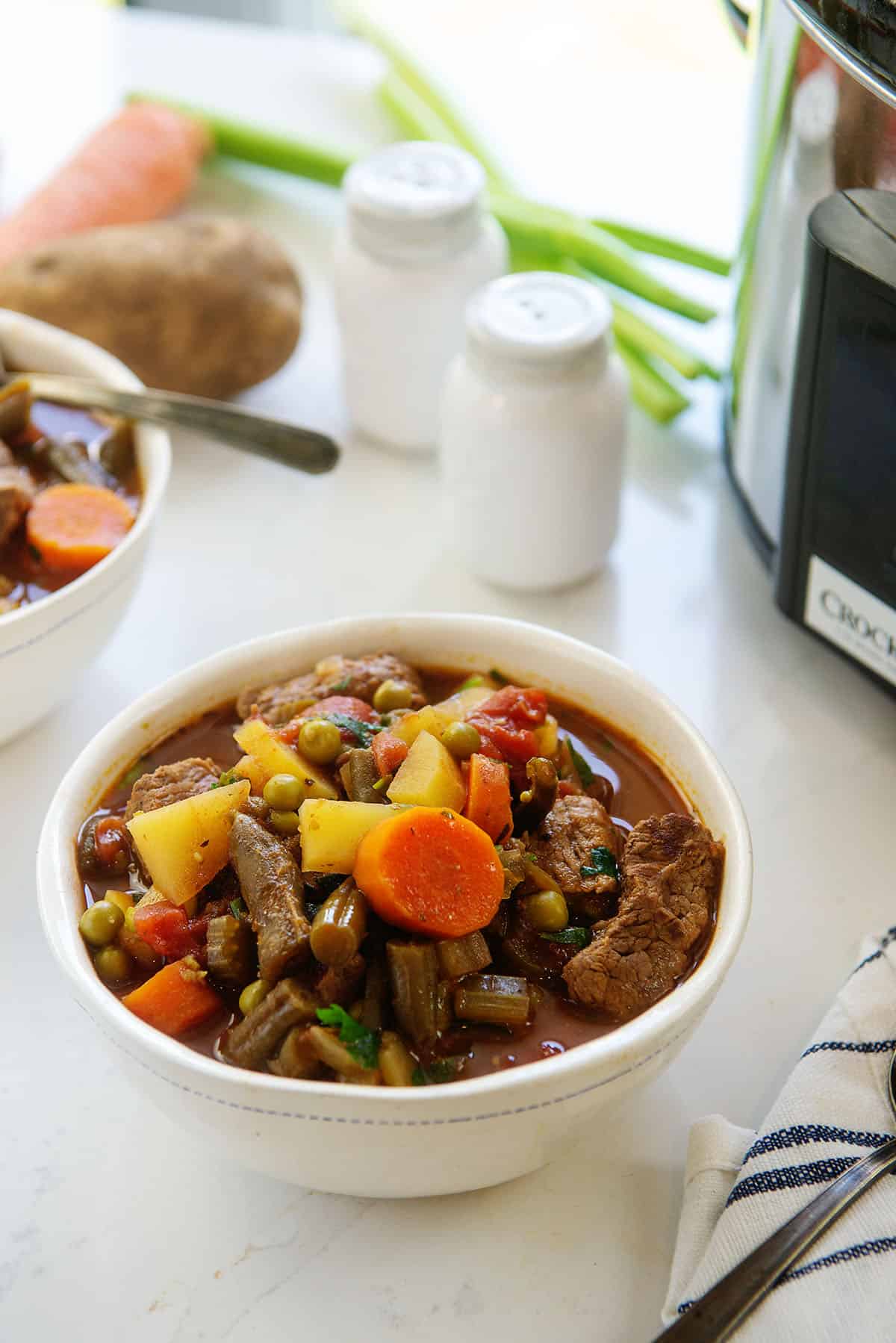 vegetable beef soup in white bowl.