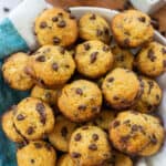 pile of mini chocolate chip muffins in bowl.
