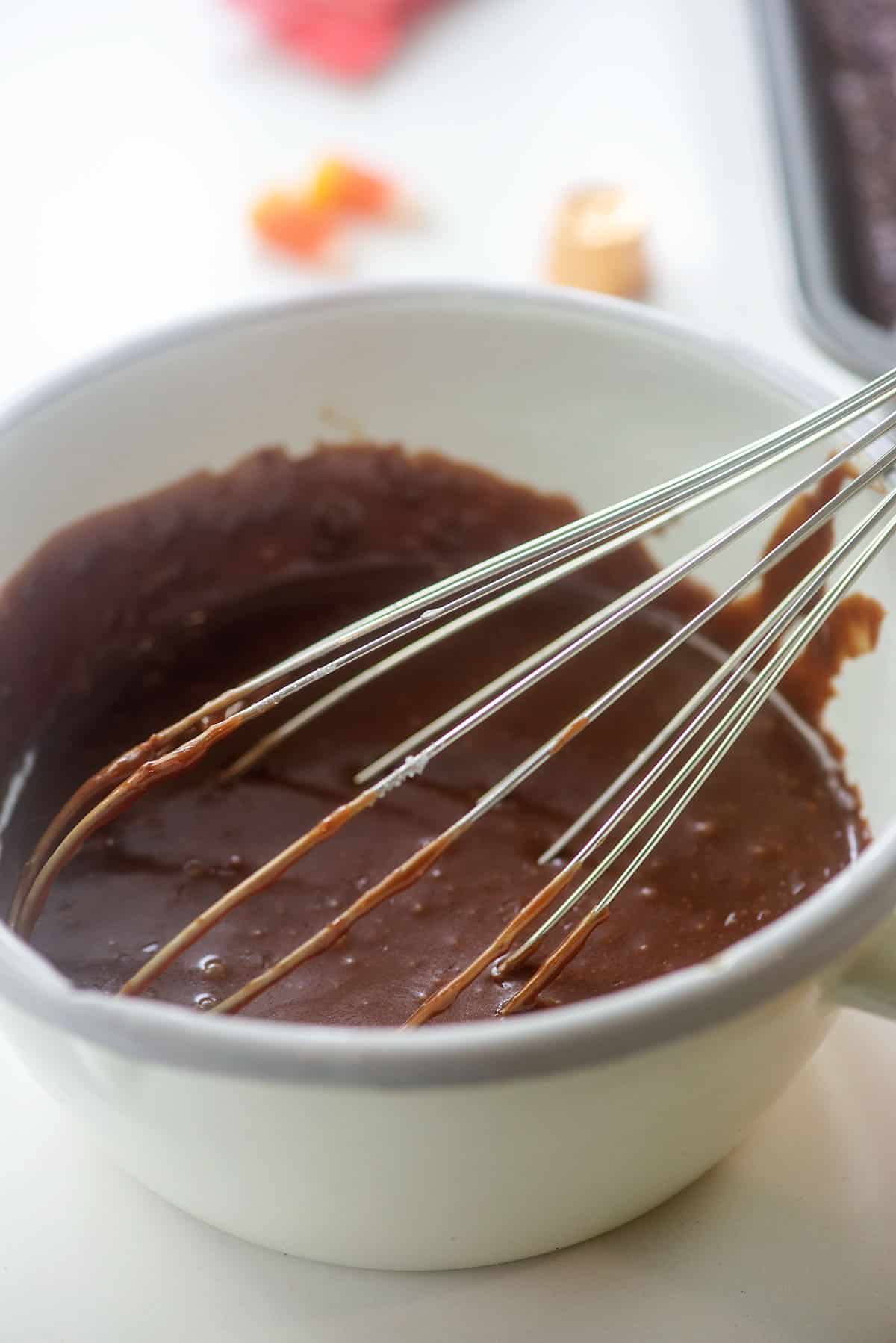 fudge frosting in white pan.