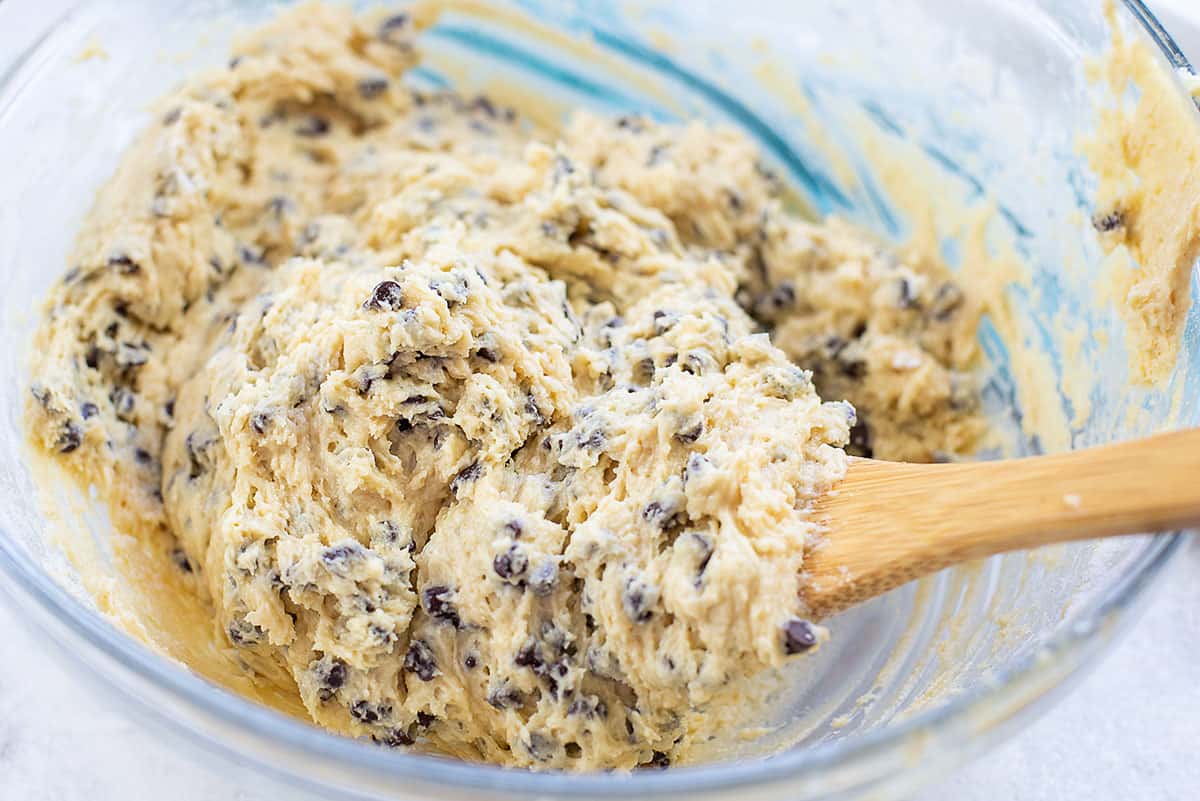 chocolate chip muffin batter in glass mixing bowl.