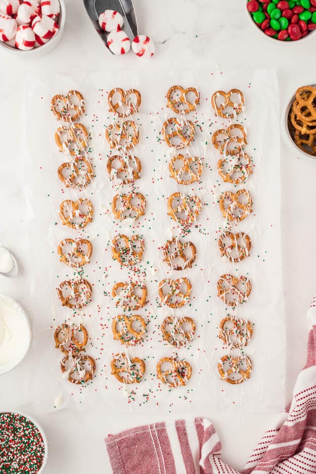 pretzels with white chocolate and sprinkles.