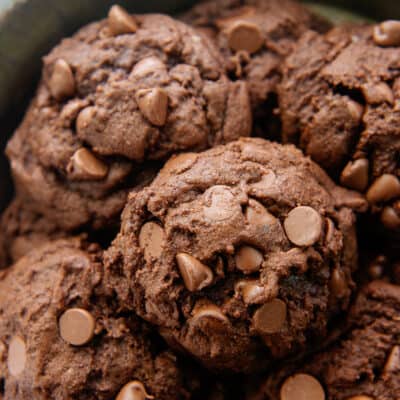 chocolate chocolate chip cookies piled in bowl.