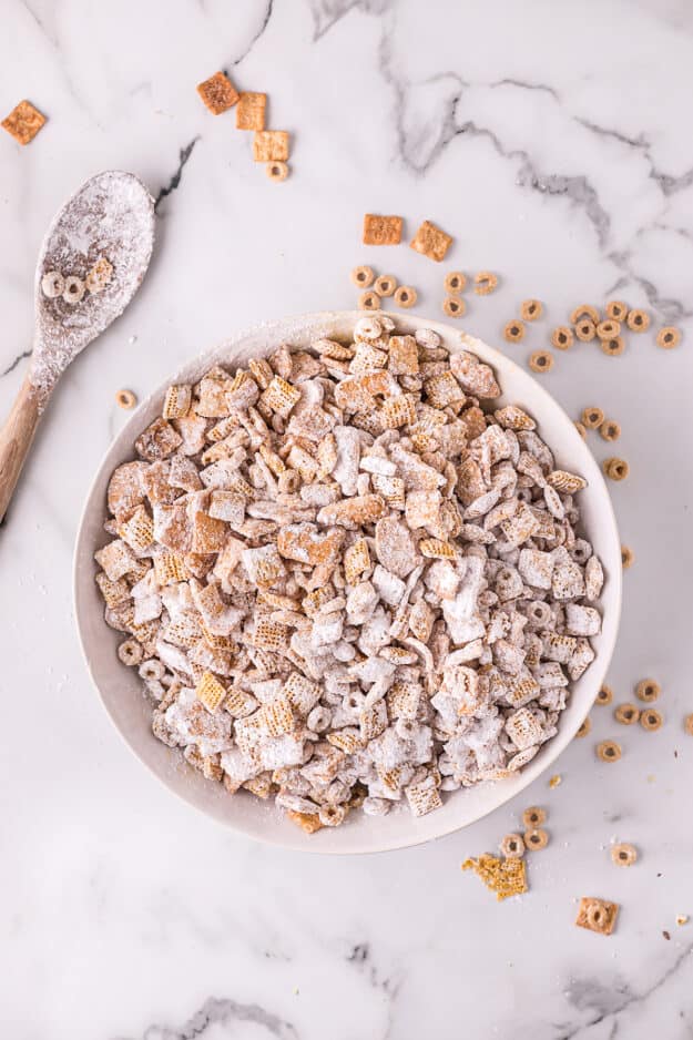 cereal coated in white chocolate and powdered sugar.