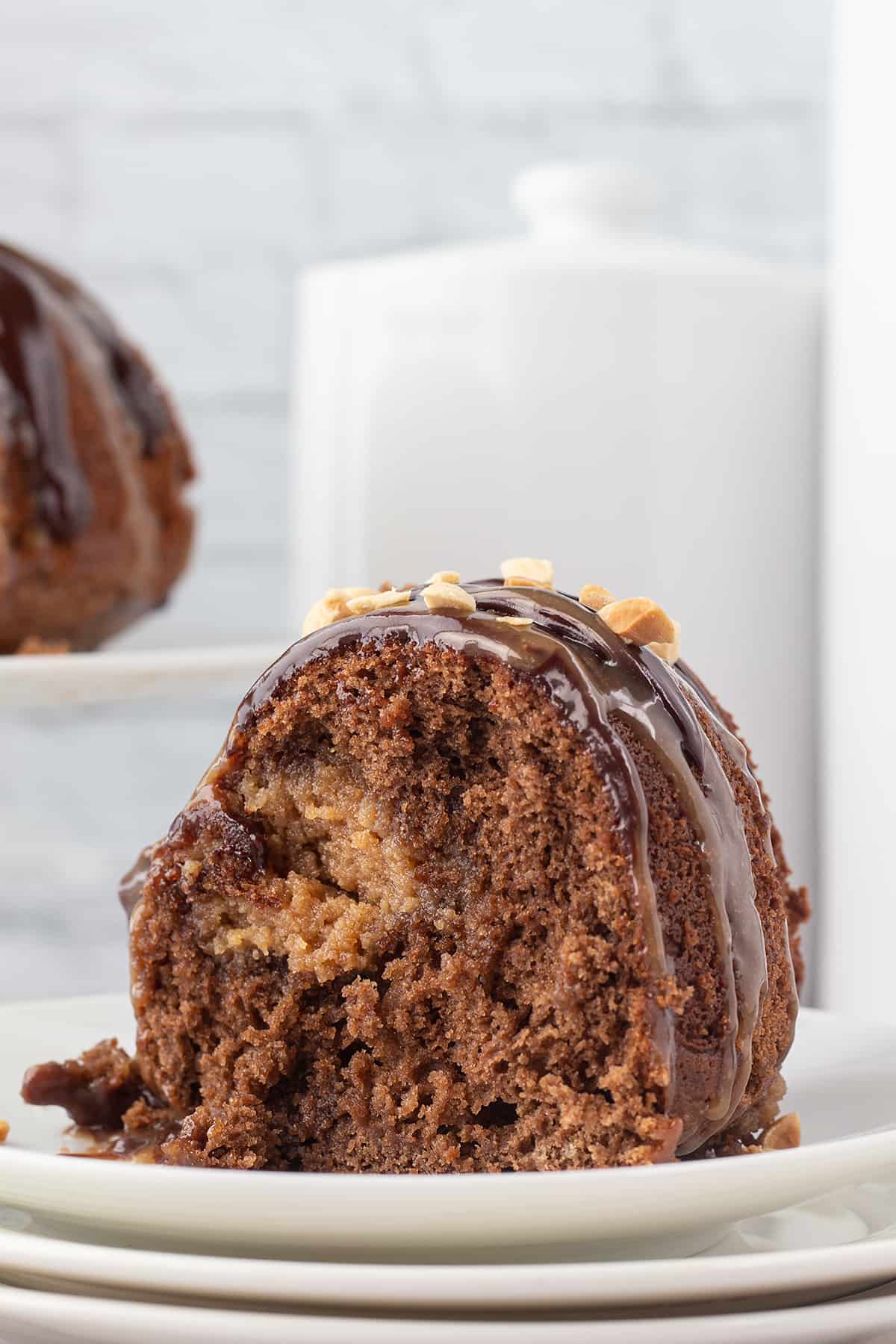 chocolate bundt cake with a peanut butter filling on a white plate.