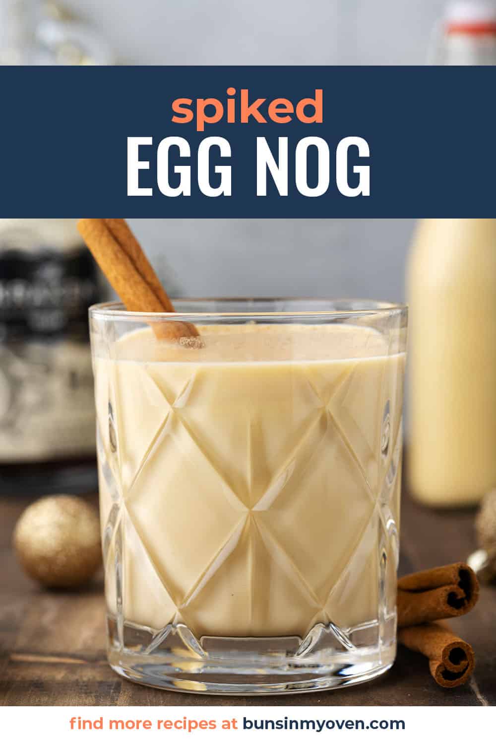 spiked eggnog in glass with text for Pinterest.
