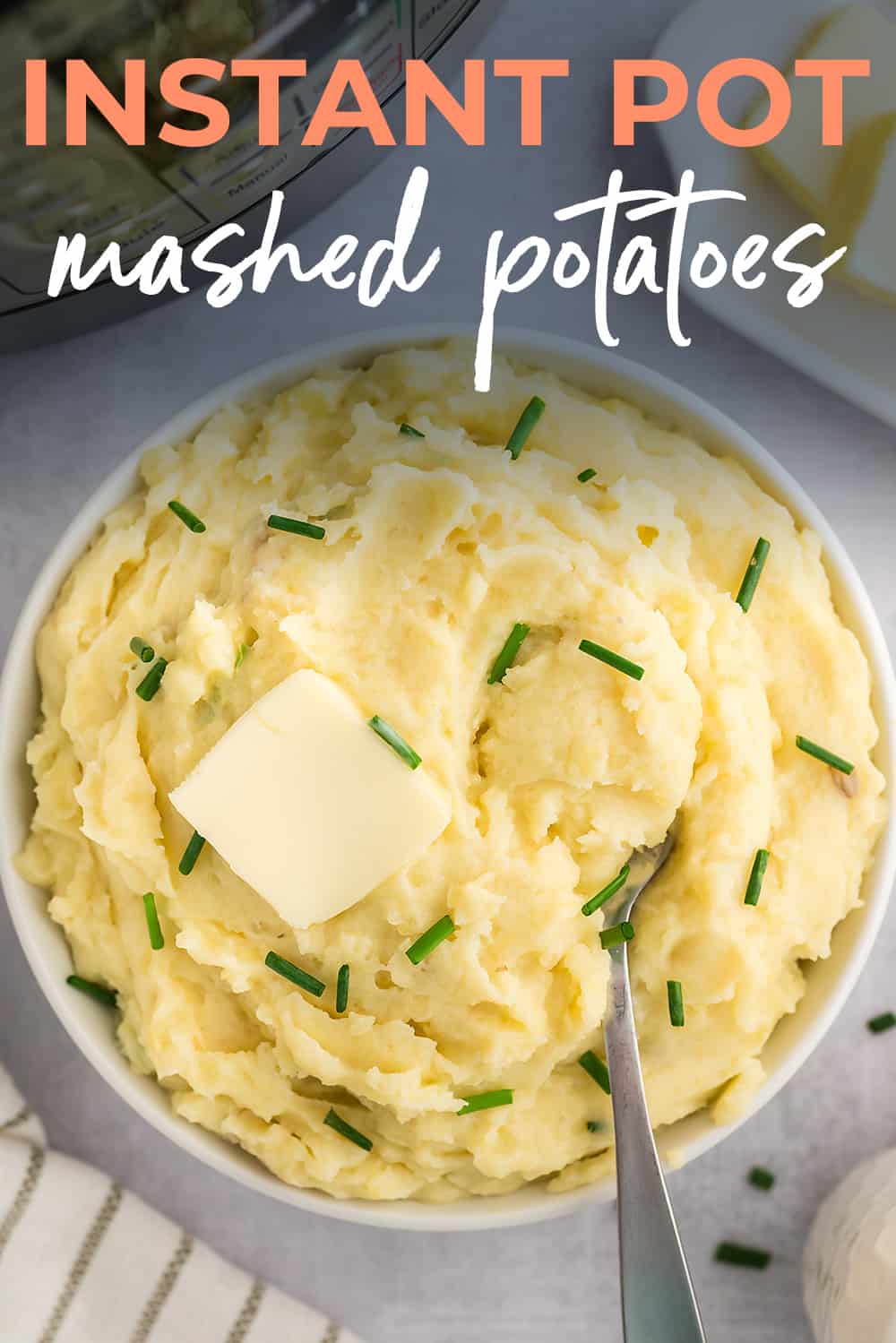 Creamy mashed potatoes in white bowl.