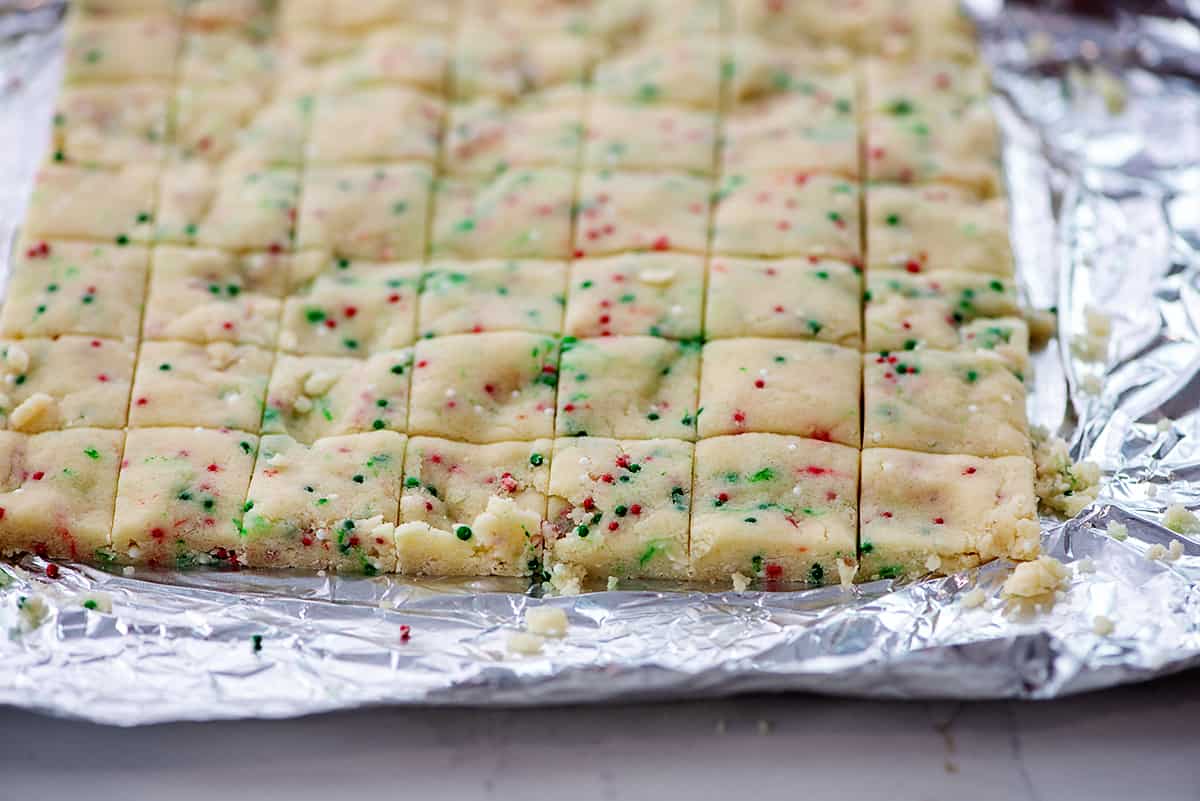 shortbread dough cut into small squares.