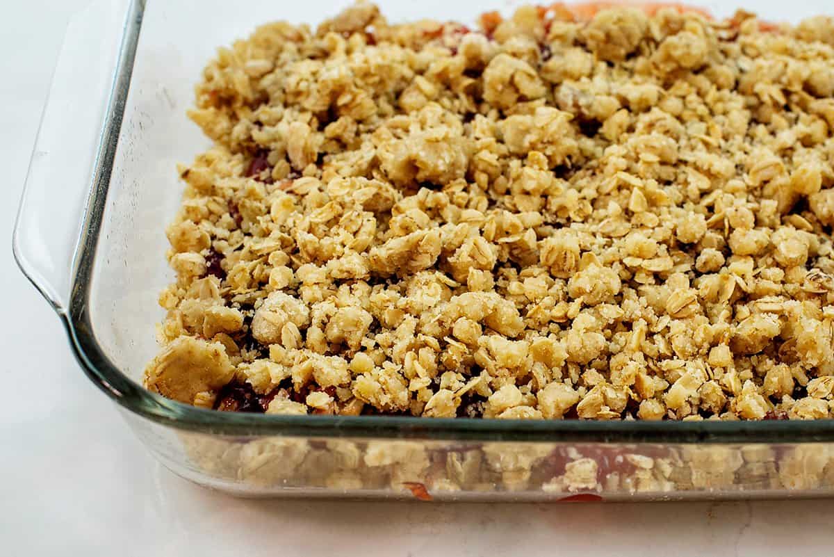 streusel topping sprinkled over jam.