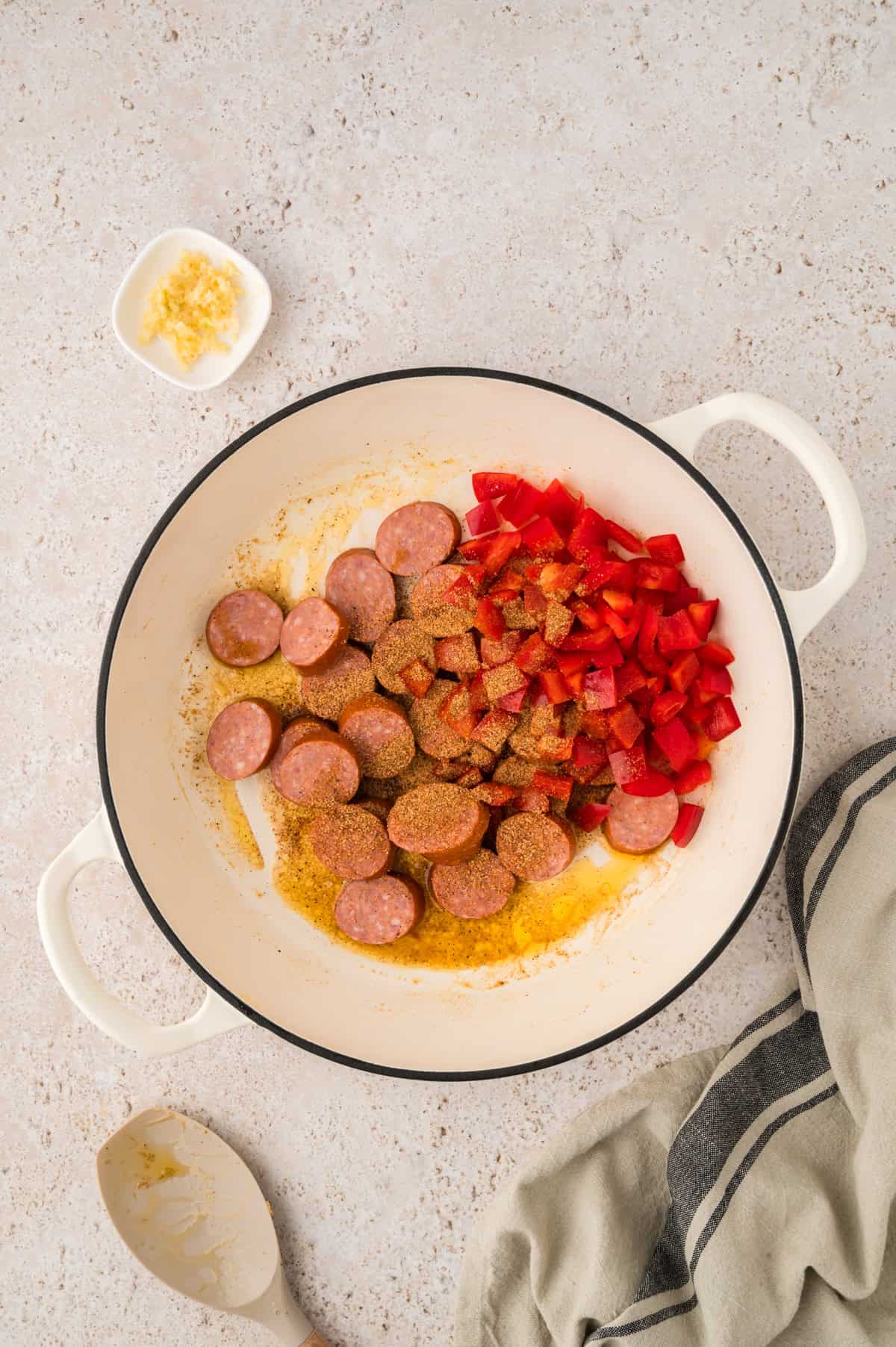 Sausage and peppers in skillet.