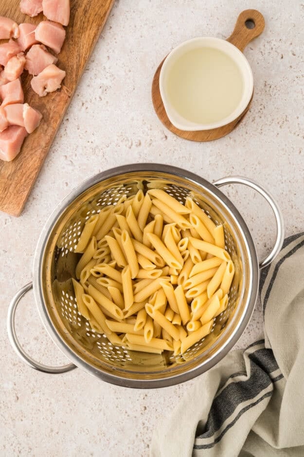 Boiled pasta in strainer.
