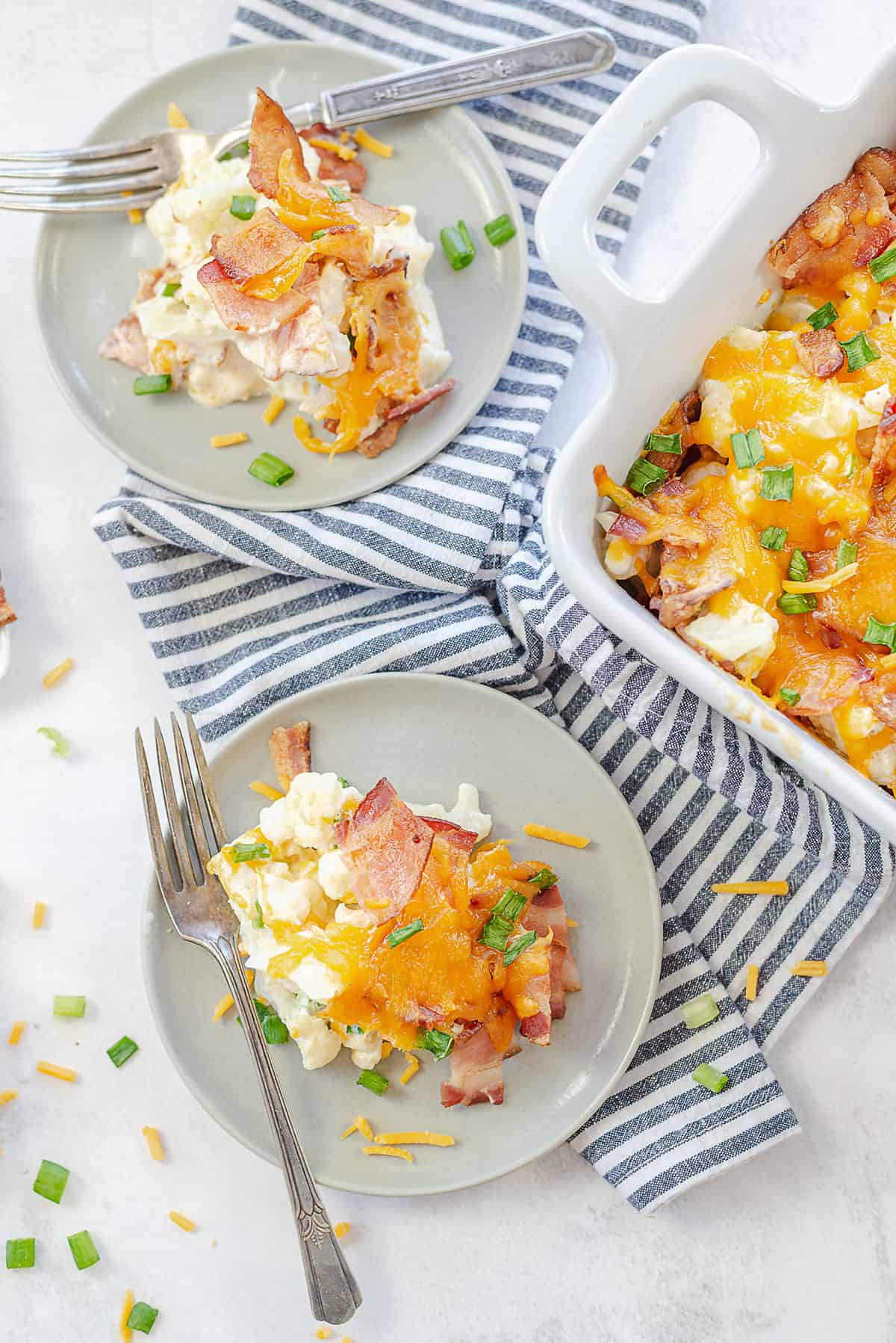 cheesy cauliflower casserole on small plates.