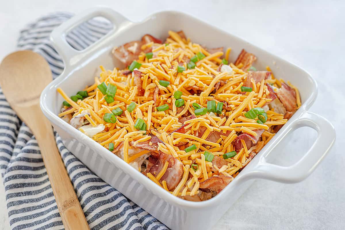 cauliflower casserole topped with cheese and bacon.