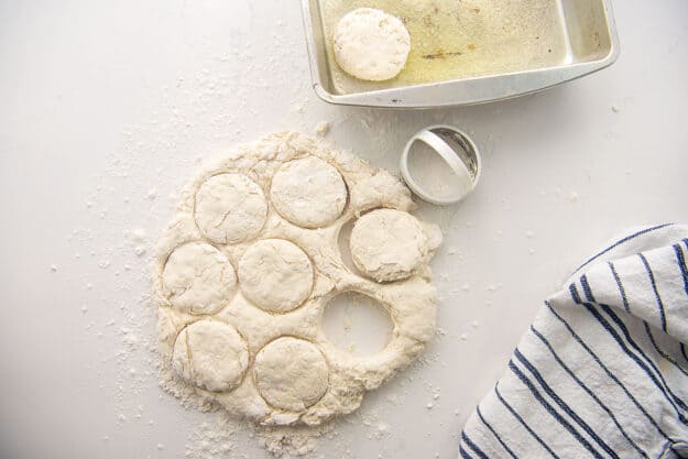 biscuits being cut from dough