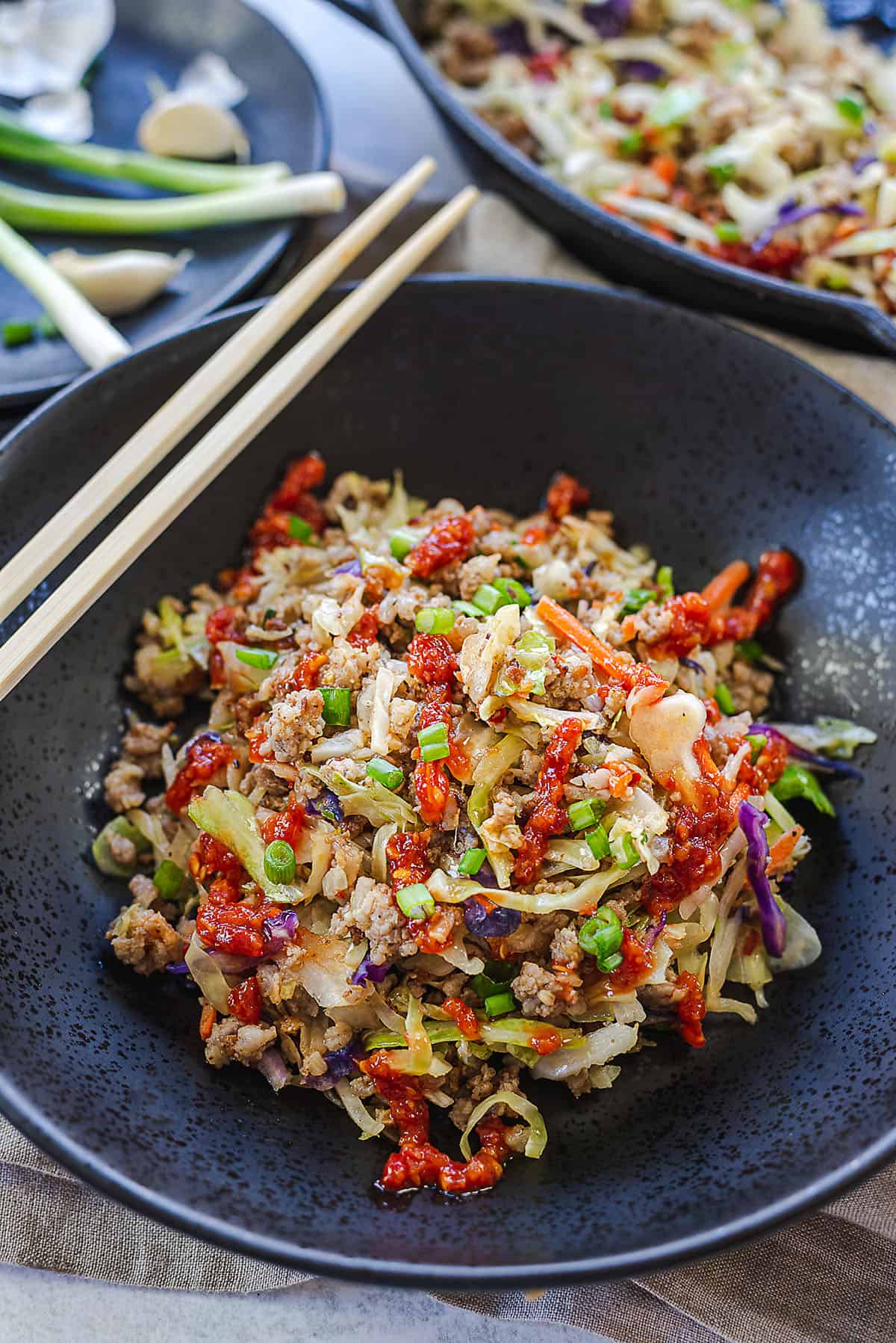 egg roll filling in a black bowl.