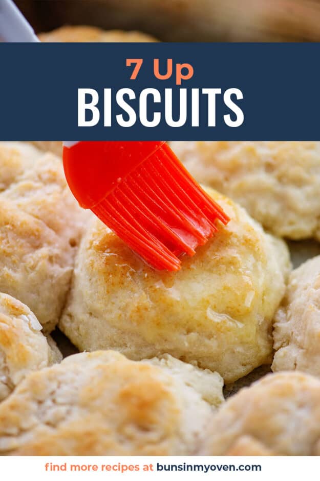 biscuits being brushed with butter.