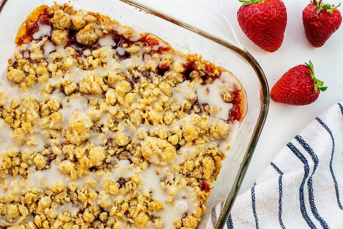 strawberry oatmeal bars drizzled with glaze.