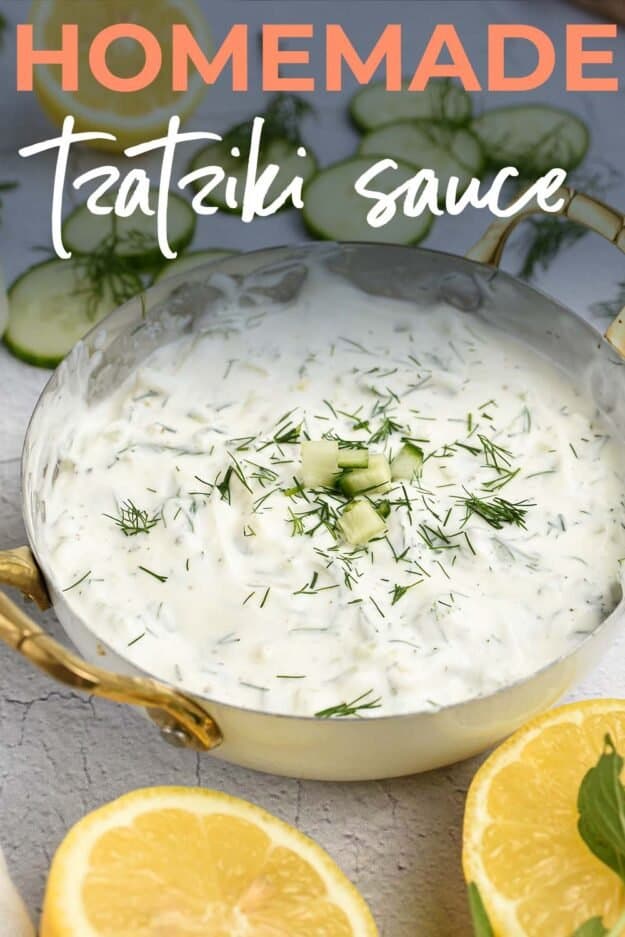 tzatziki dip in bowl with fresh herbs.