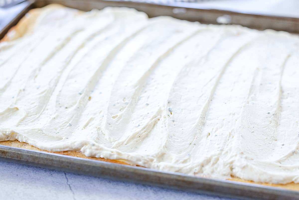 cream cheese spread over crescent dough.