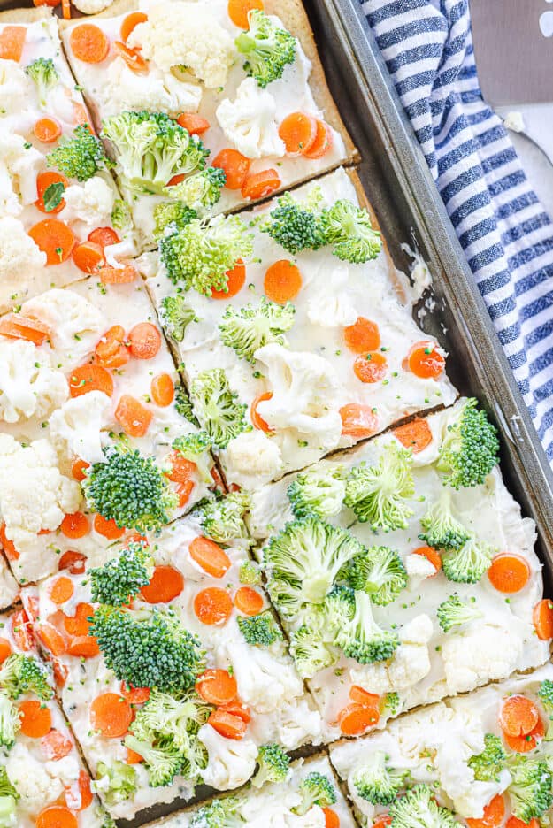 cold veggie pizza on sheet pan.