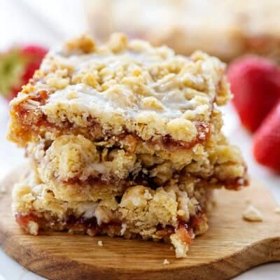 strawberry oatmeal bars on small round board.