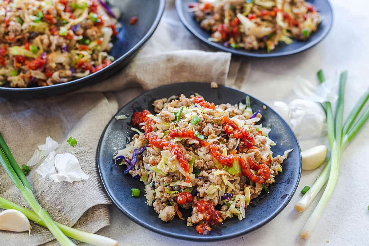 egg roll in a bowl in black bowls.