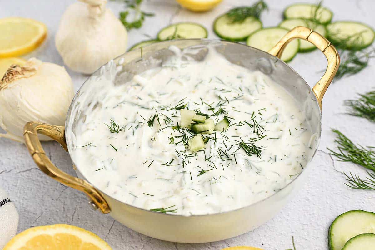 Greek tzatziki sauce in small bowl.