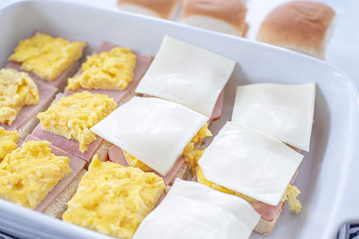 rolls topped with ham, egg, and cheese.