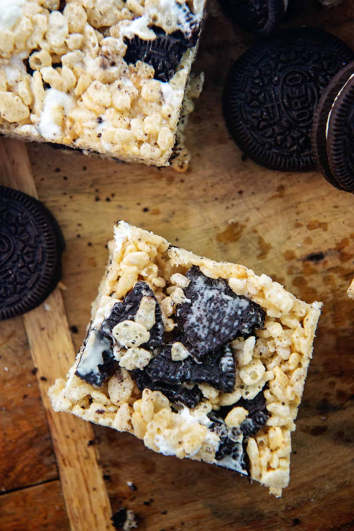 Oreo rice krispies treats on wooden board.