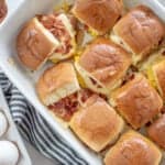 breakfast sliders in white baking dish.