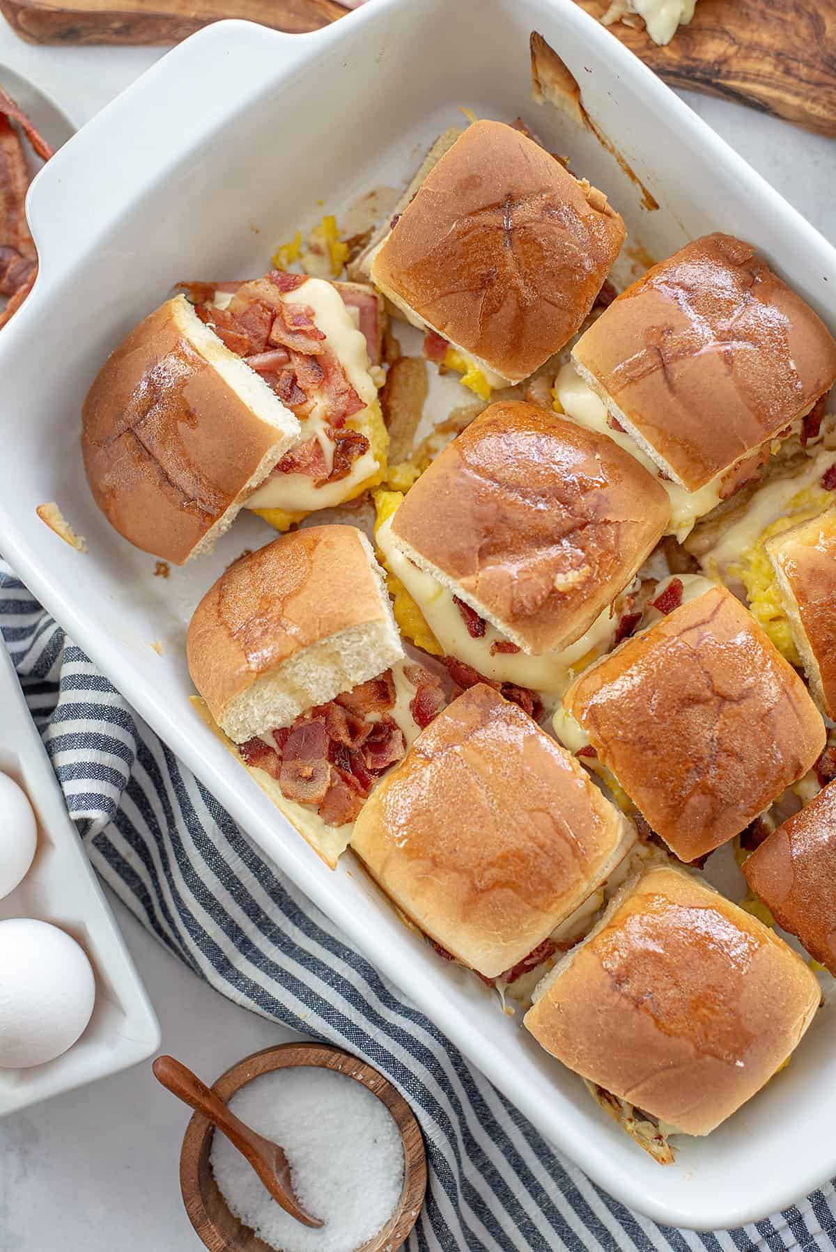 breakfast sliders in white baking dish.