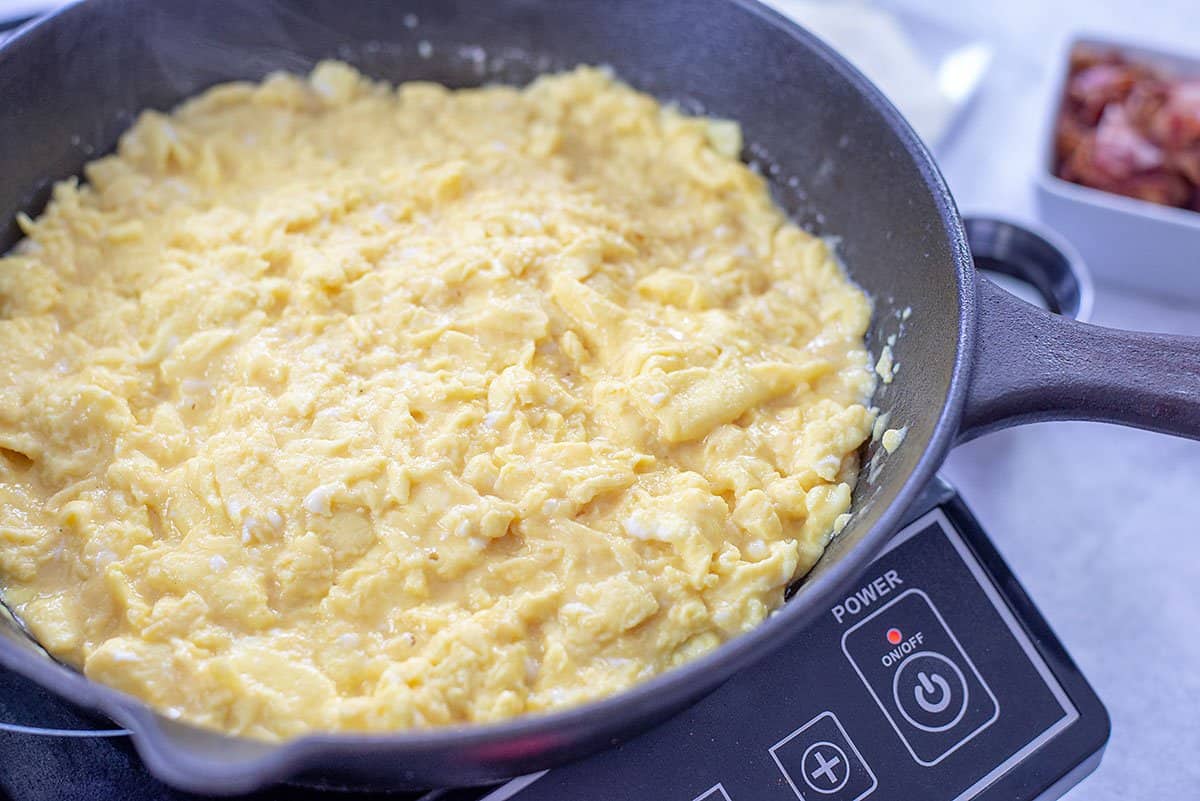scrambled eggs in skillet.