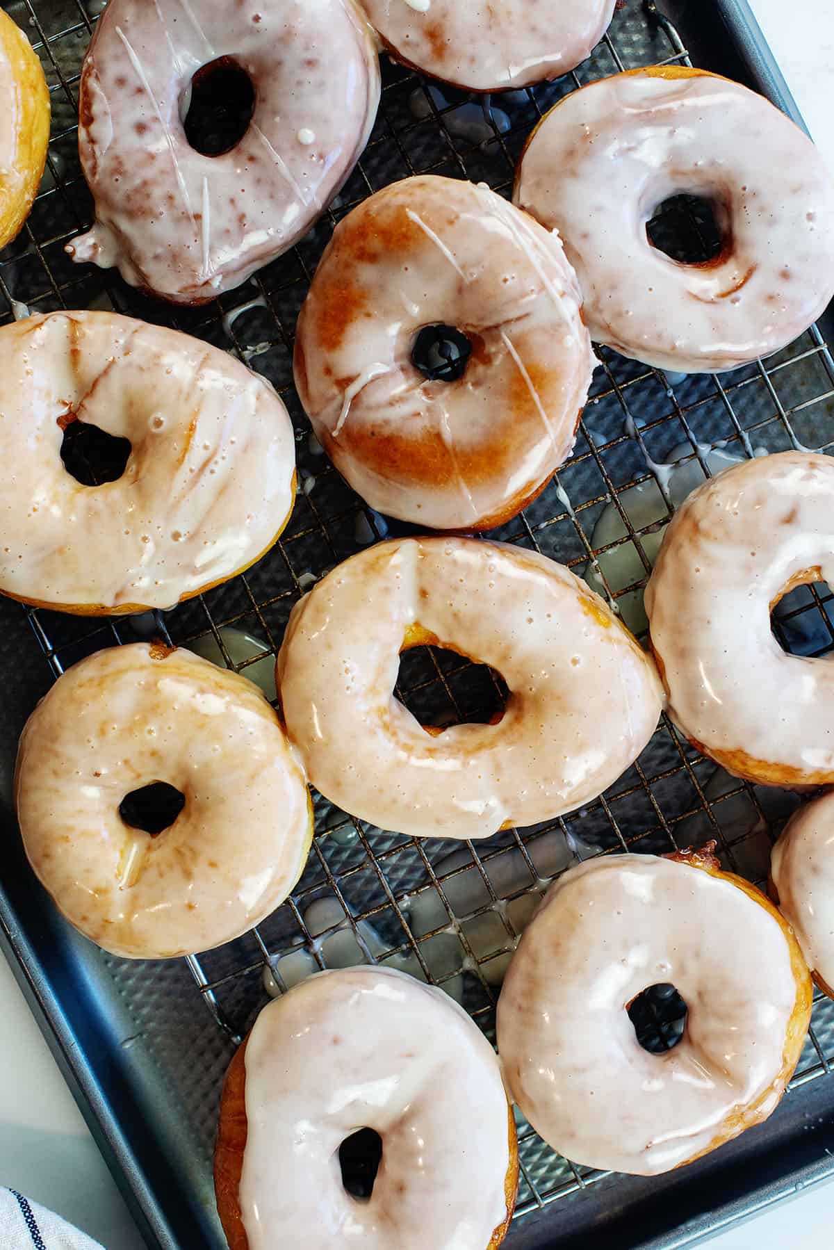 glazed donuts on sheet pan.