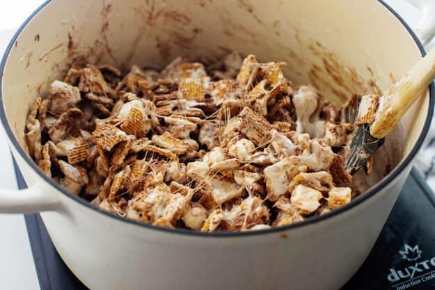 golden graham cereal mixture in pan.