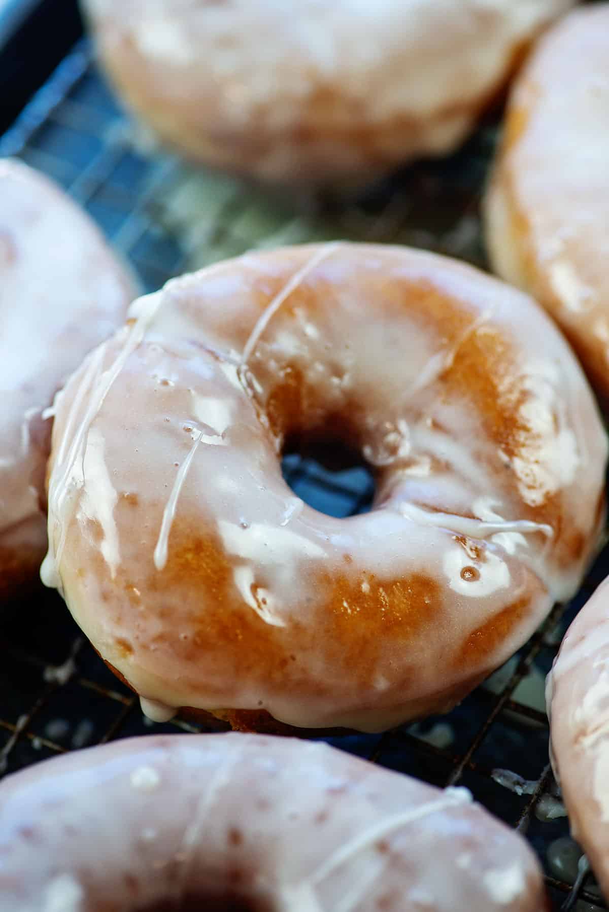 potato donuts piled on rack.